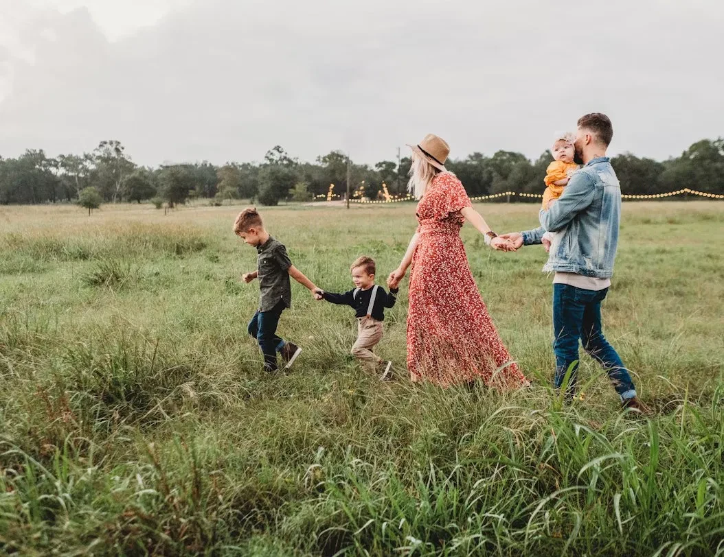 A mother and family walking together outdoors